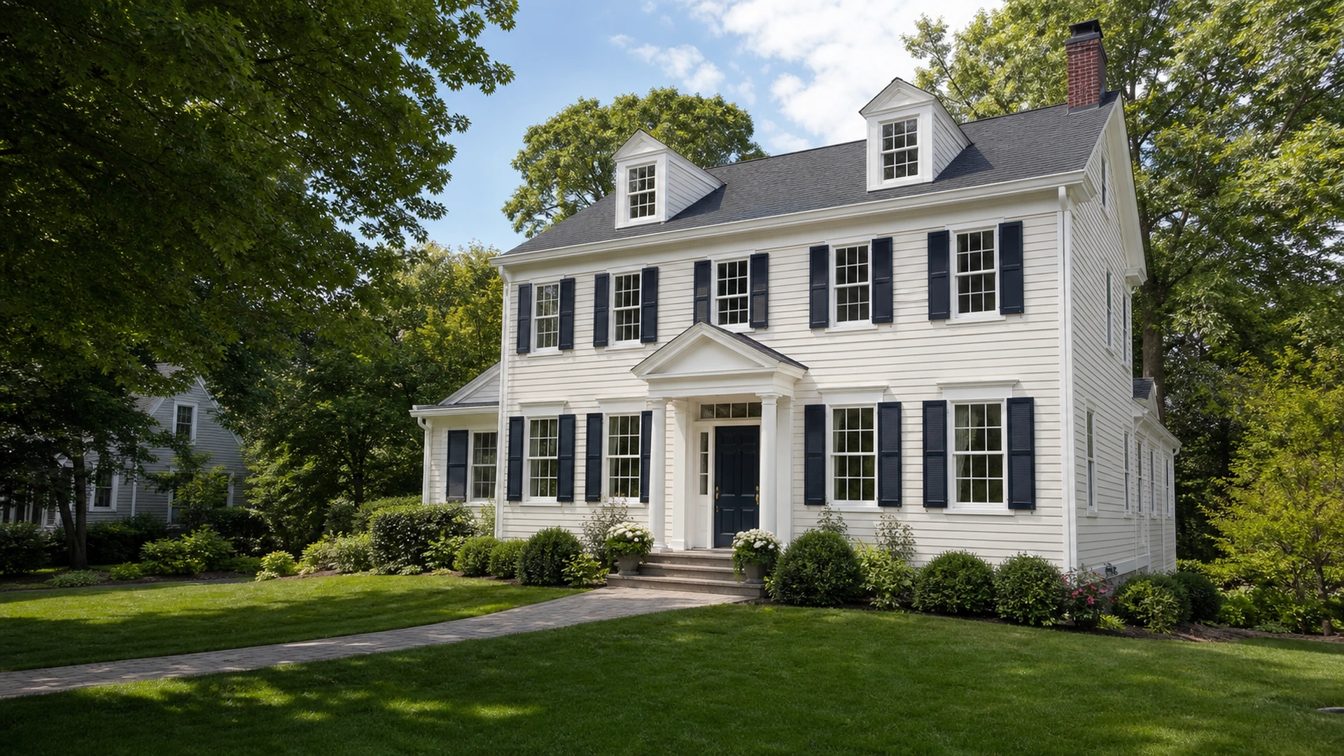 Residential home in Newton, MA with a freshly painted exterior and renewed white trim.
